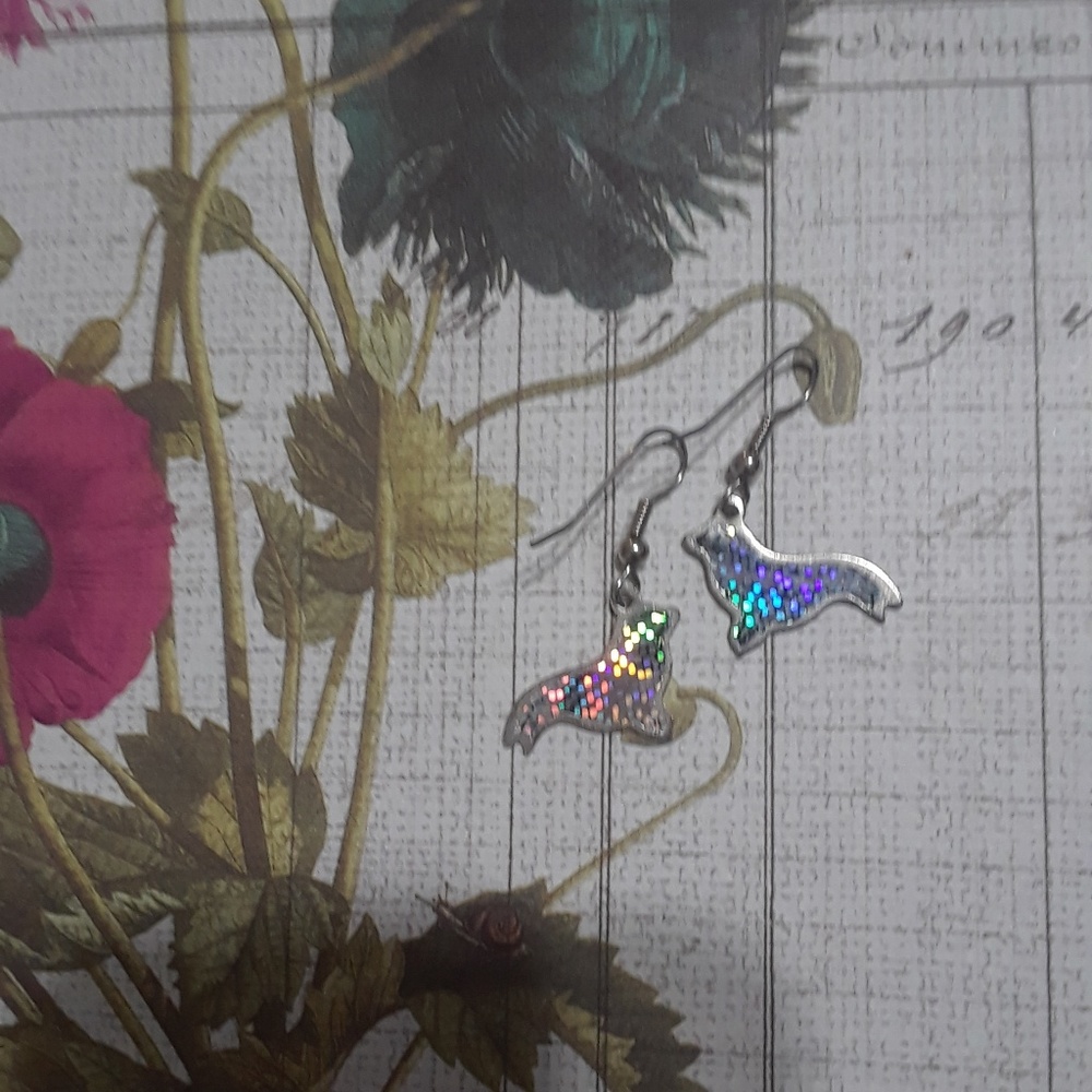 Holographic seal earrings.